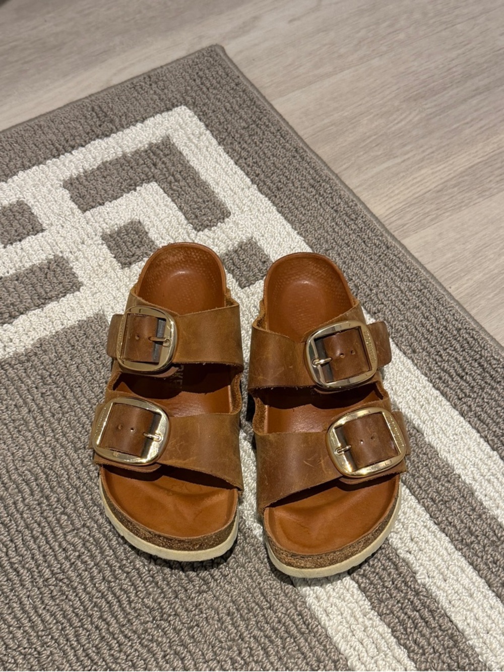 Brown and gold hardware Birkenstocks